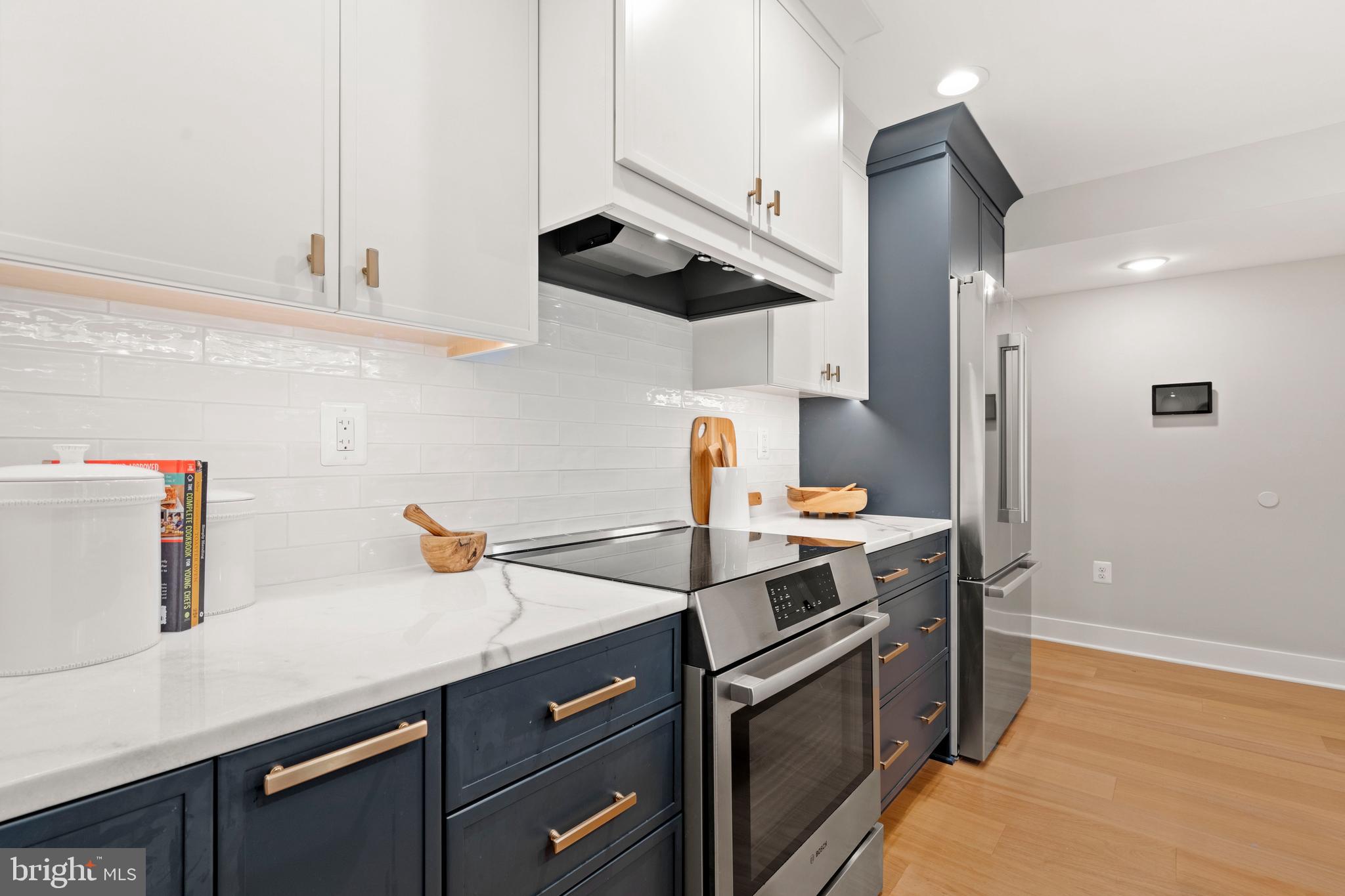 910 9th Street Northeast, Unit 1 Washington, DC 20002 - Photo 17 of 66 a kitchen with stainless steel appliances granite countertop a sink a stove and a refrigerator