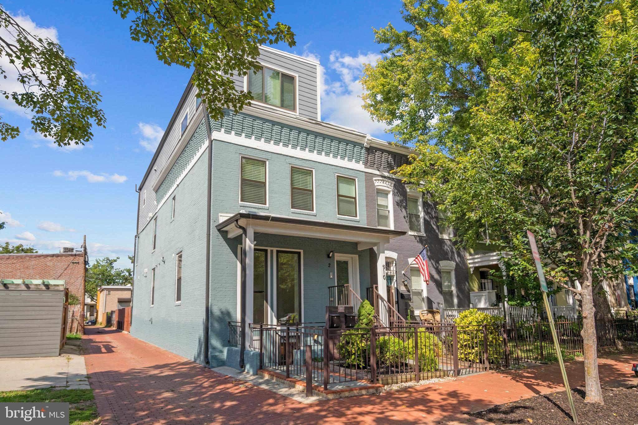 910 9th Street Northeast, Unit 1 Washington, DC 20002 - Photo 2 of 66 a front view of a house with garden