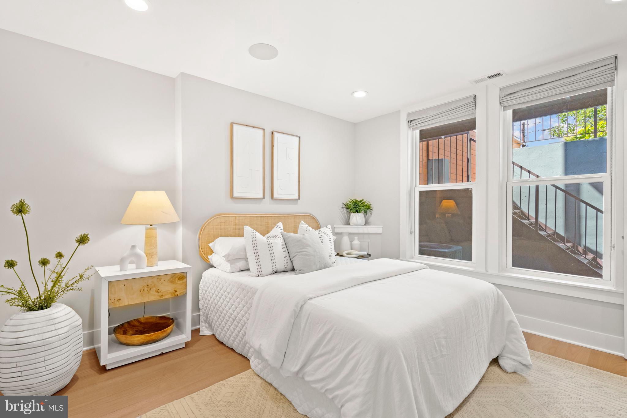 910 9th Street Northeast, Unit 1 Washington, DC 20002 - Photo 21 of 66 a bedroom with a bed and a window