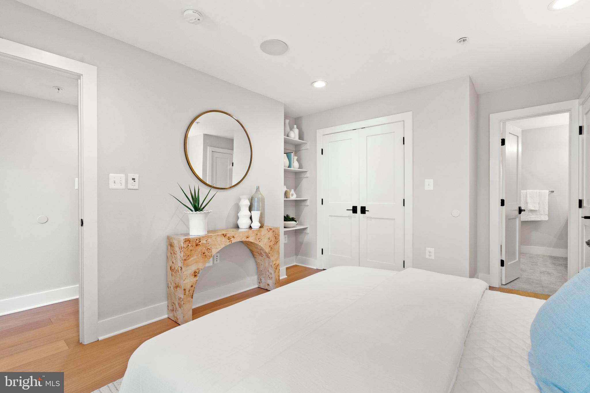 910 9th Street Northeast, Unit 1 Washington, DC 20002 - Photo 24 of 66 a bedroom with a bed and a chandelier