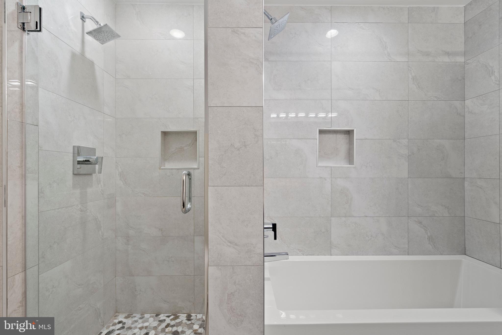 910 9th Street Northeast, Unit 1 Washington, DC 20002 - Photo 26 of 66 a bathroom with a bathtub and shower