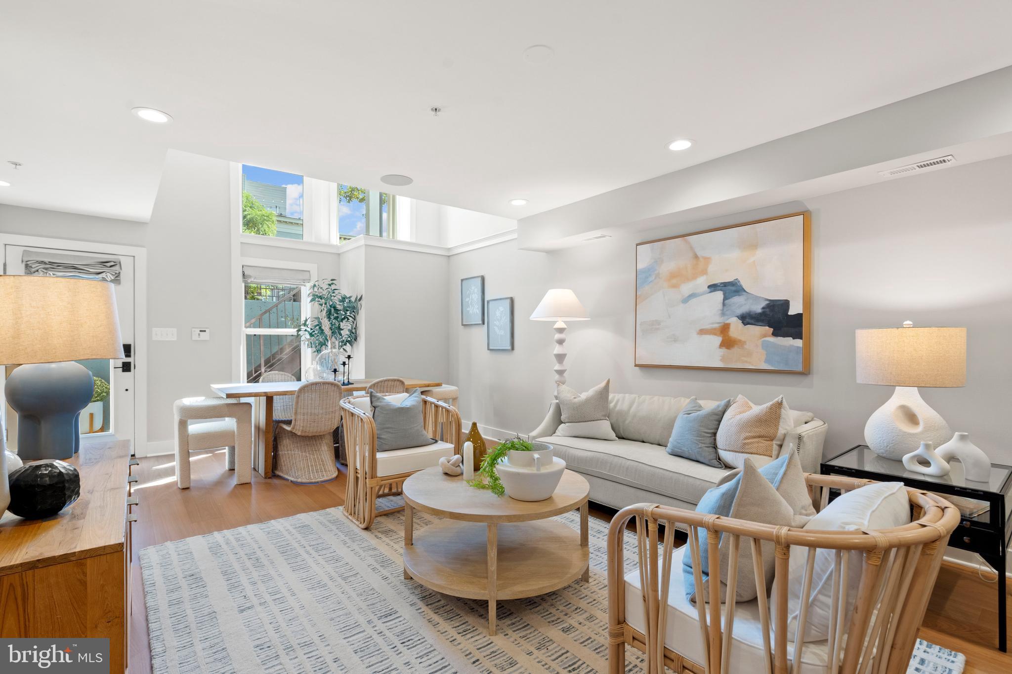 910 9th Street Northeast, Unit 1 Washington, DC 20002 - Photo 3 of 66 a living room with furniture and wooden floor