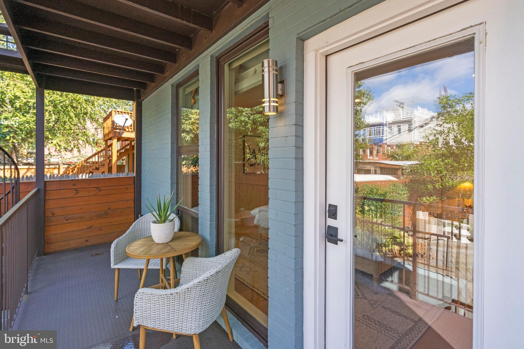 910 9th Street Northeast, Unit 1 Washington, DC 20002 - Photo 36 of 66 a view of a porch with chairs and backyard