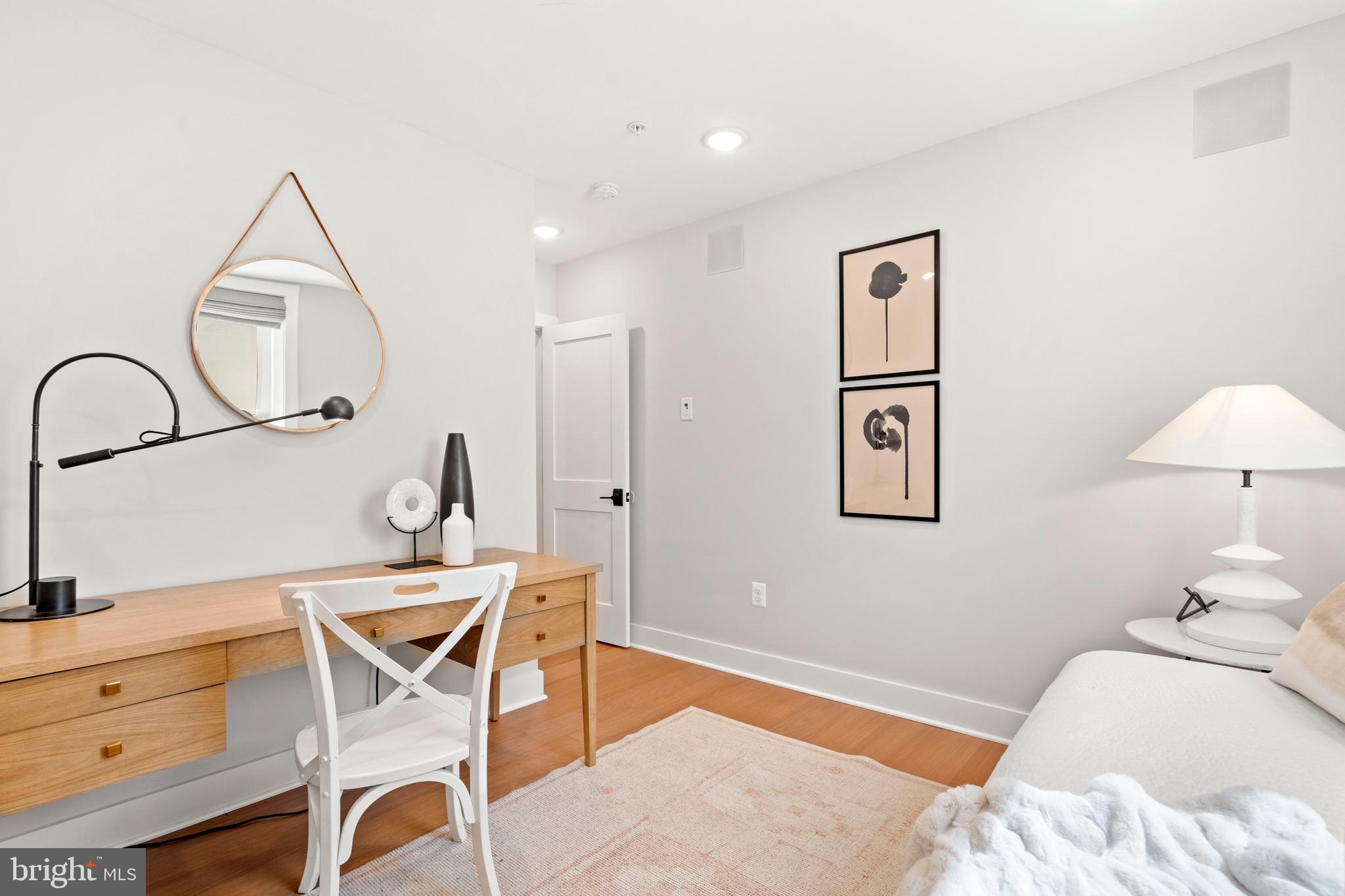 910 9th Street Northeast, Unit 1 Washington, DC 20002 - Photo 43 of 66 a bedroom with a bed and a chandelier