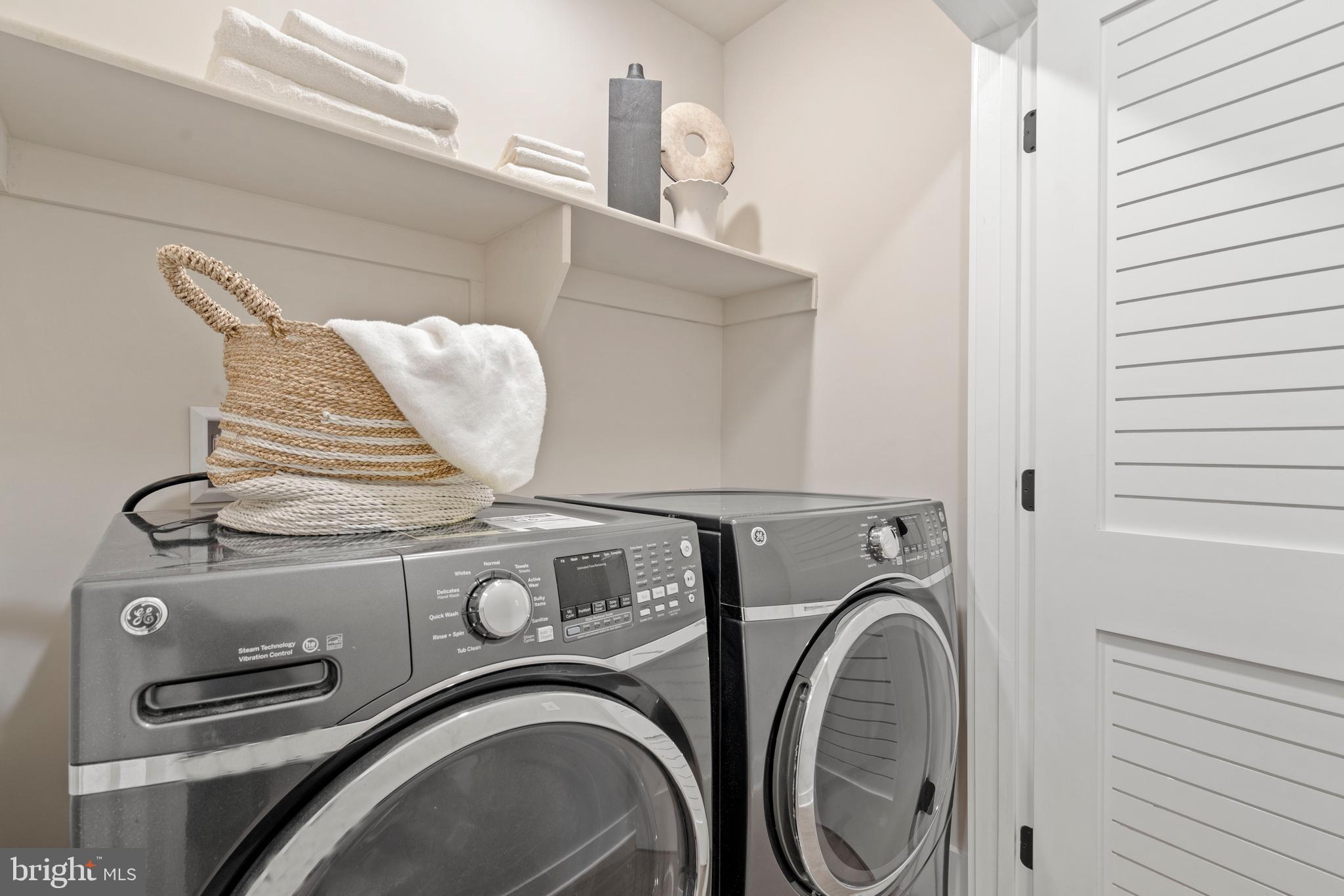 910 9th Street Northeast, Unit 1 Washington, DC 20002 - Photo 50 of 66 a utility room with dryer and washer