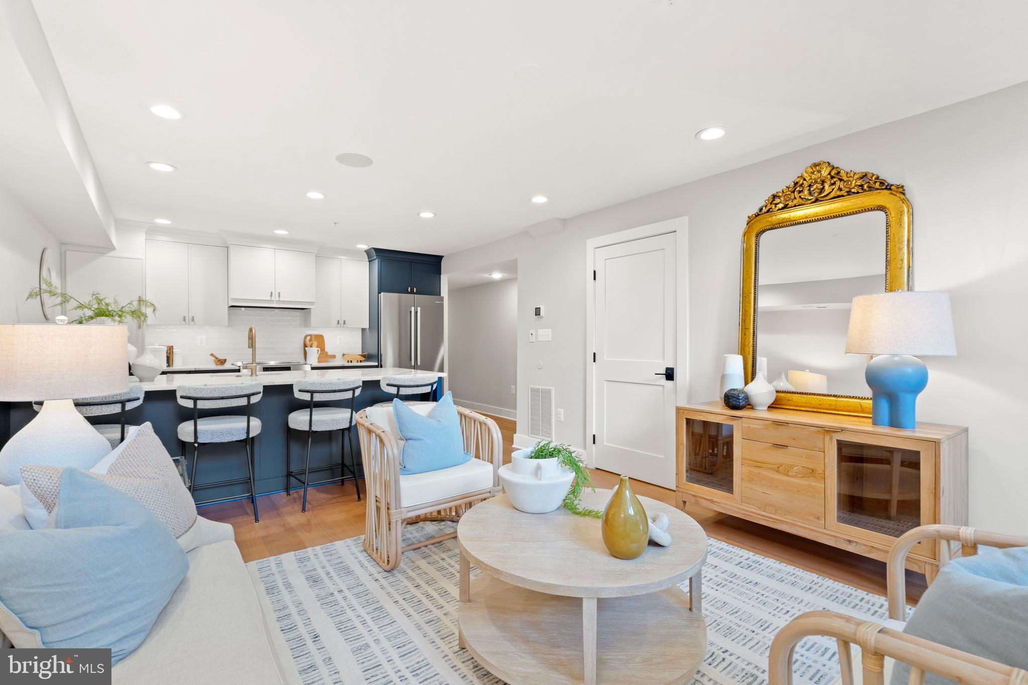 910 9th Street Northeast, Unit 1 Washington, DC 20002 - Photo 5 of 66 a living room with furniture and a table