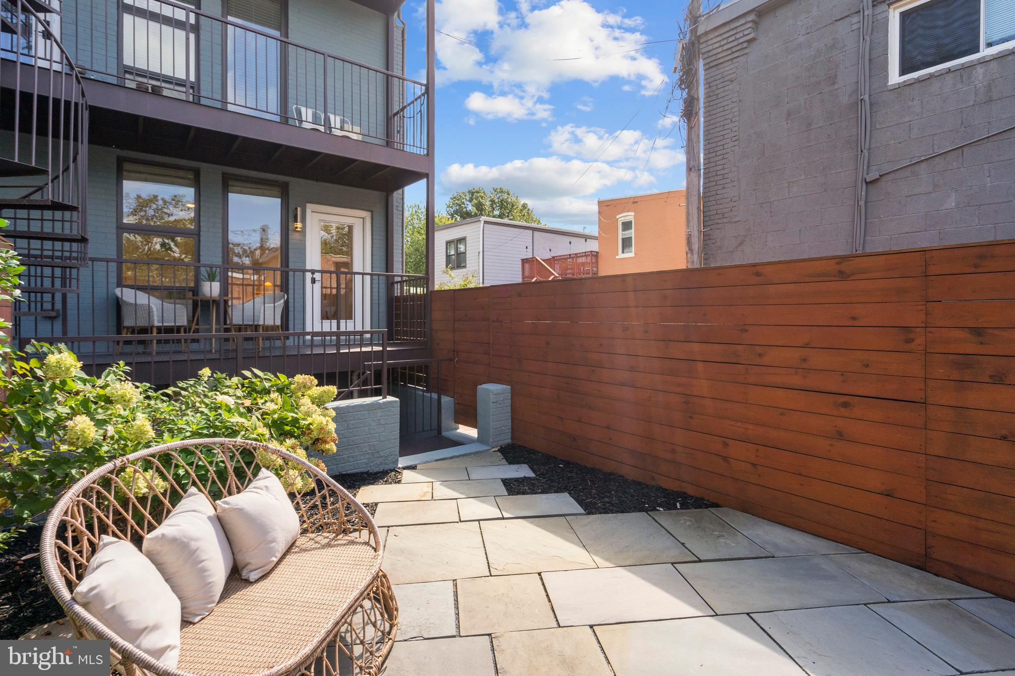 910 9th Street Northeast, Unit 1 Washington, DC 20002 - Photo 53 of 66 a view of a chairs and table in the patio