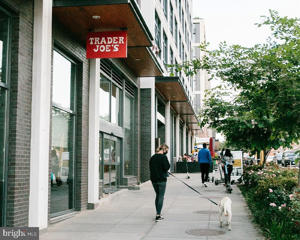 910 9th Street Northeast, Unit 1 Washington, DC 20002 - Photo 64 of 66 a street sign on a sidewalk next to a road