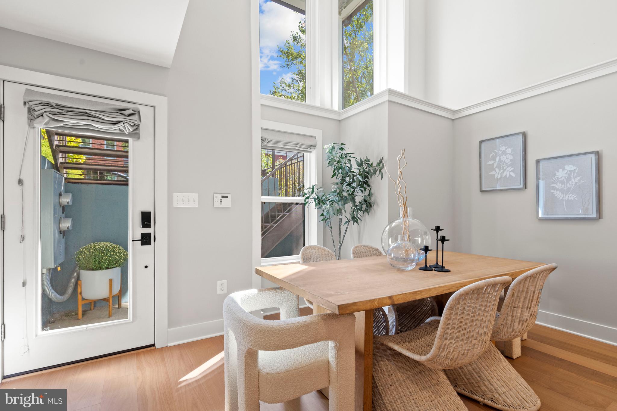 910 9th Street Northeast, Unit 1 Washington, DC 20002 - Photo 9 of 66 a view of a dining room with furniture and wooden floor