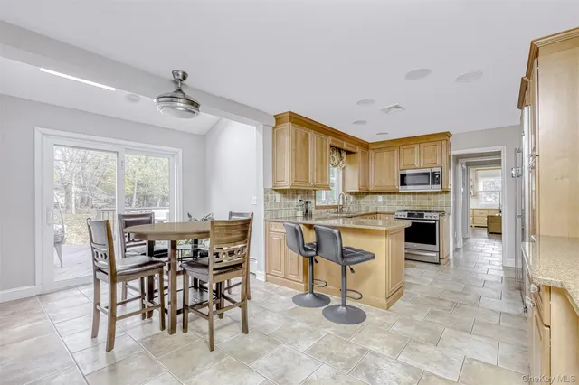 a view of a dining room kitchen and a window