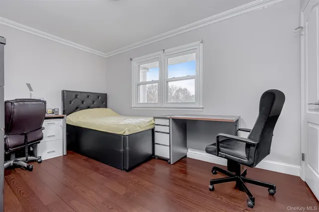 a view of workspace with wooden floor windows