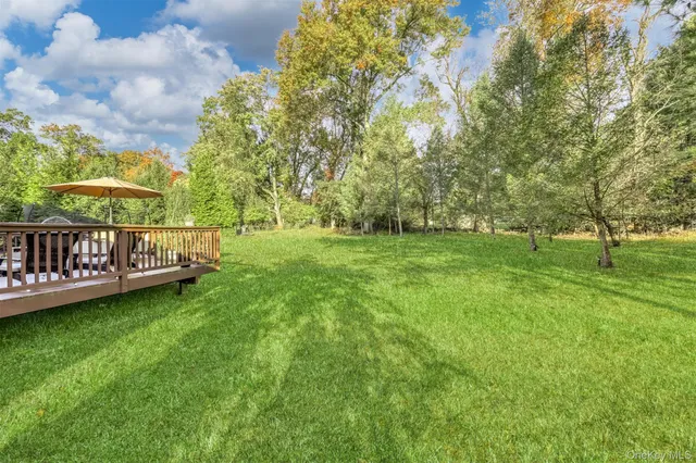 an outdoor space with furniture and umbrella