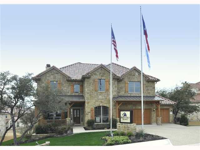 16100 Spillman Ranch Loop Austin, TX 78738 - Photo 1 of 1 a front view of a house with yard