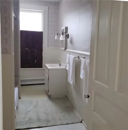 a view of a hallway with seating area