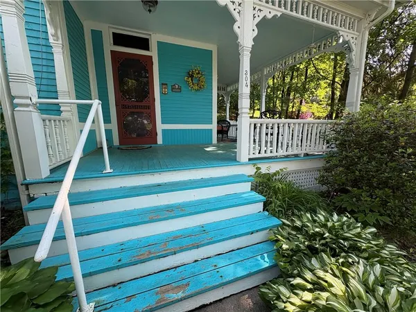 a view of stairs and potted plants