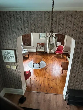 a view of an entryway with wooden floor