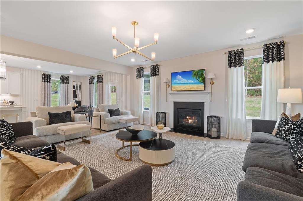 229 Ruthe Cove Locust Grove, GA 30248 - Photo 13 of 56 a living room with furniture and a fireplace