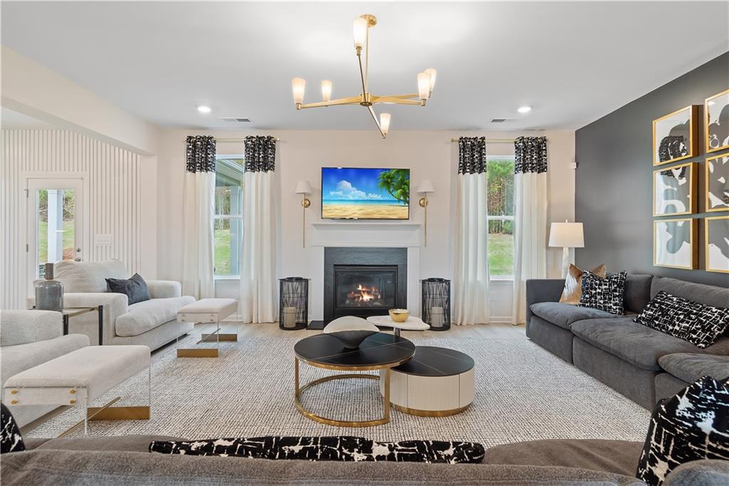 229 Ruthe Cove Locust Grove, GA 30248 - Photo 14 of 56 a living room with furniture and a fireplace