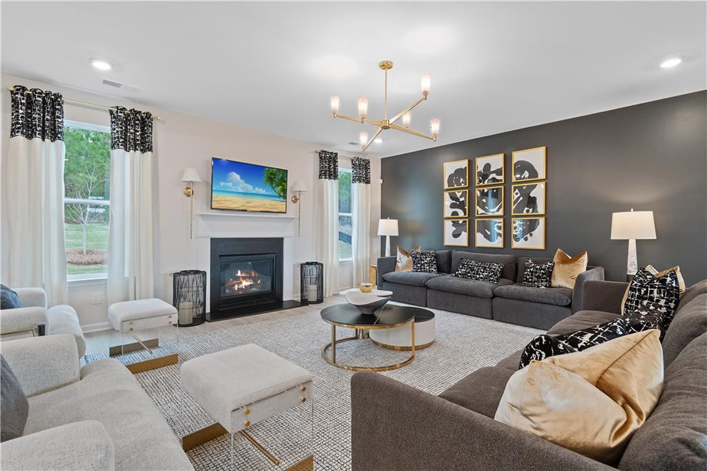 229 Ruthe Cove Locust Grove, GA 30248 - Photo 15 of 56 a living room with furniture and a fireplace