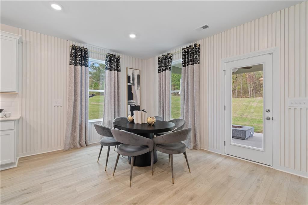 229 Ruthe Cove Locust Grove, GA 30248 - Photo 20 of 56 a dining room with furniture and window