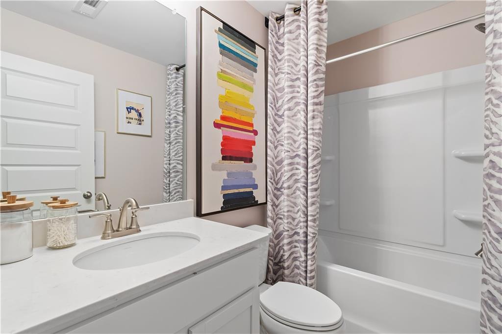 229 Ruthe Cove Locust Grove, GA 30248 - Photo 29 of 56 a bathroom with a sink toilet and shower