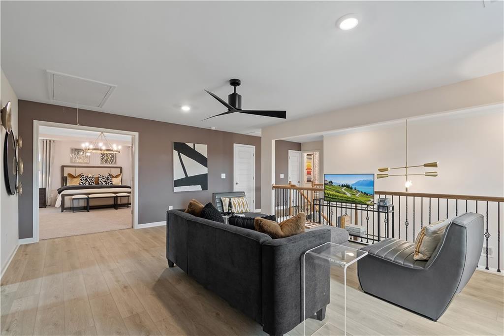 229 Ruthe Cove Locust Grove, GA 30248 - Photo 31 of 56 a living room with furniture and a flat screen tv