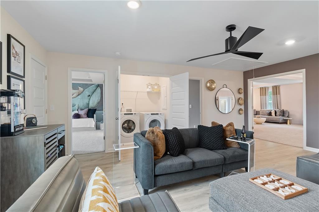 229 Ruthe Cove Locust Grove, GA 30248 - Photo 33 of 56 a living room with furniture and a large window