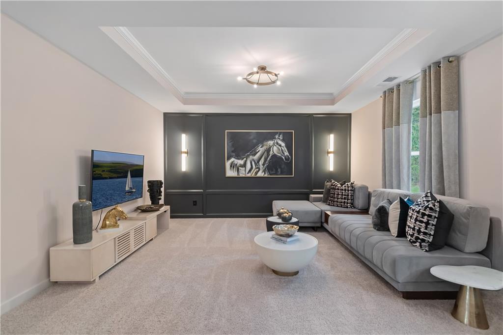 229 Ruthe Cove Locust Grove, GA 30248 - Photo 40 of 56 a living room with furniture and a large window