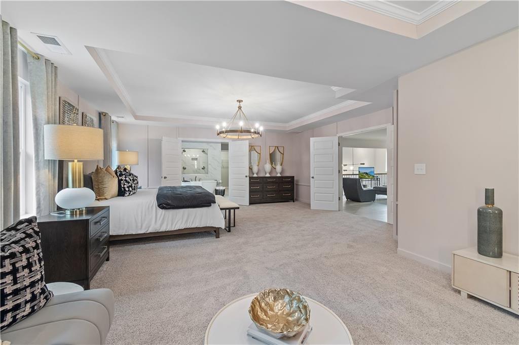 229 Ruthe Cove Locust Grove, GA 30248 - Photo 42 of 56 a living room with furniture and a chandelier