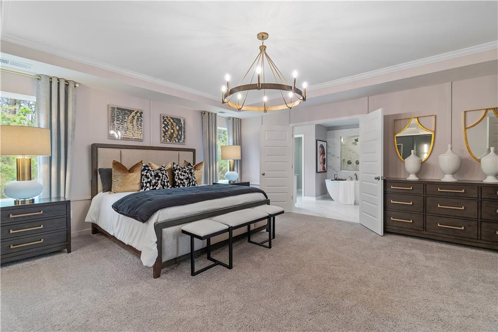 229 Ruthe Cove Locust Grove, GA 30248 - Photo 43 of 56 a bedroom with a bed and a dresser