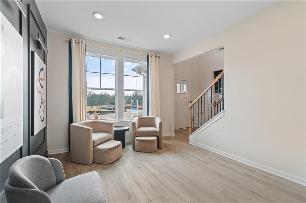 229 Ruthe Cove Locust Grove, GA 30248 - Photo 6 of 56 a living room with furniture and a window