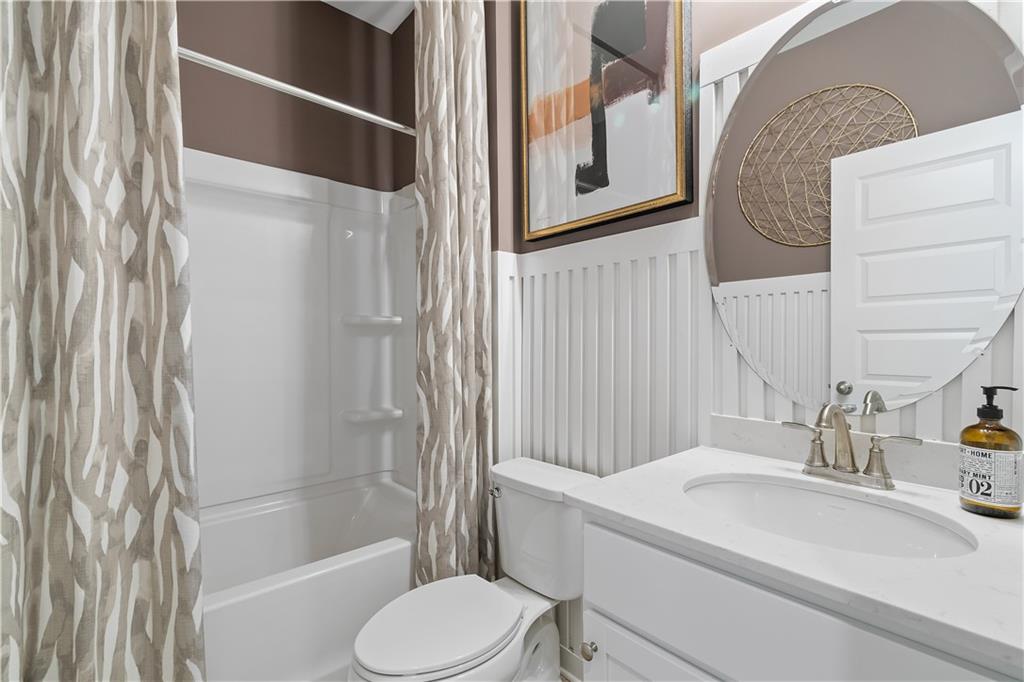 229 Ruthe Cove Locust Grove, GA 30248 - Photo 10 of 56 a bathroom with a sink toilet and shower