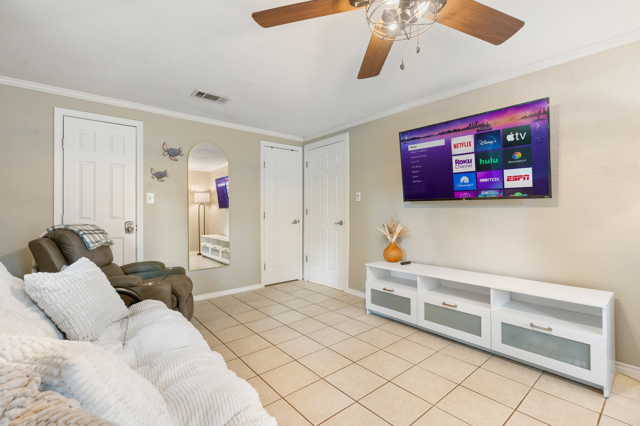 14758 Kirbee Drive Conroe, TX 77302 - Photo 13 of 35 Discover a cozy first-floor sitting area that features a convenient second walk-in closet, perfect for relaxing and organizing.