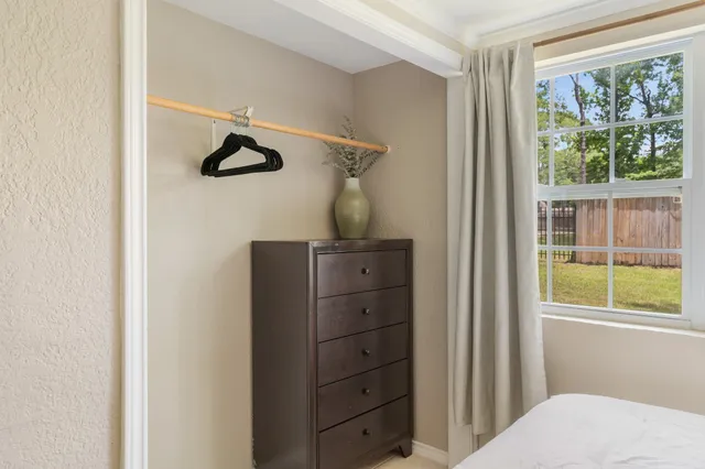 a kitchen with kitchen island granite countertop a stove and a cabinets
