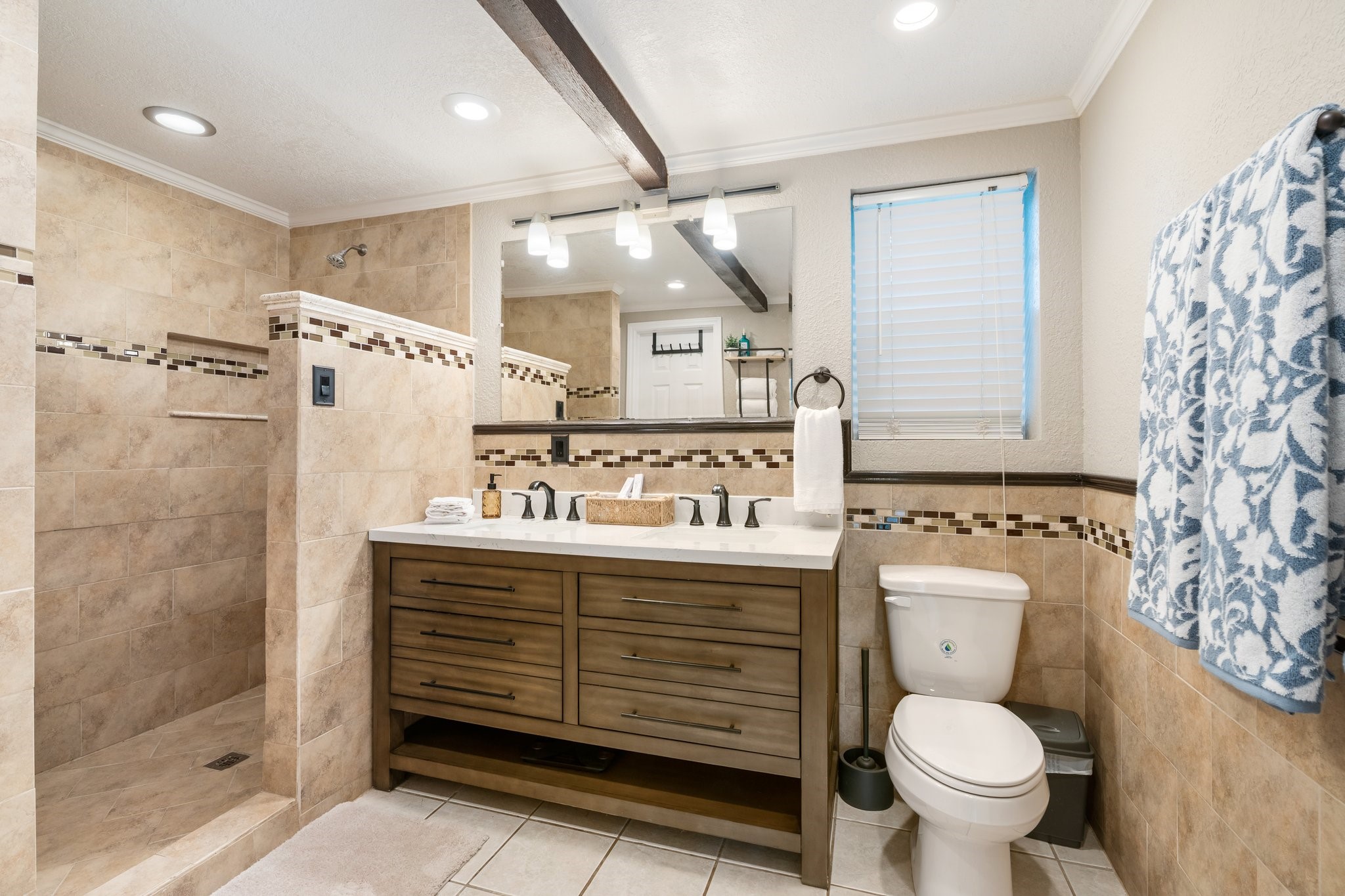 14758 Kirbee Drive Conroe, TX 77302 - Photo 16 of 35 Experience luxurious comfort in this first-floor master bathroom, featuring an oversized shower perfect for relaxation.
