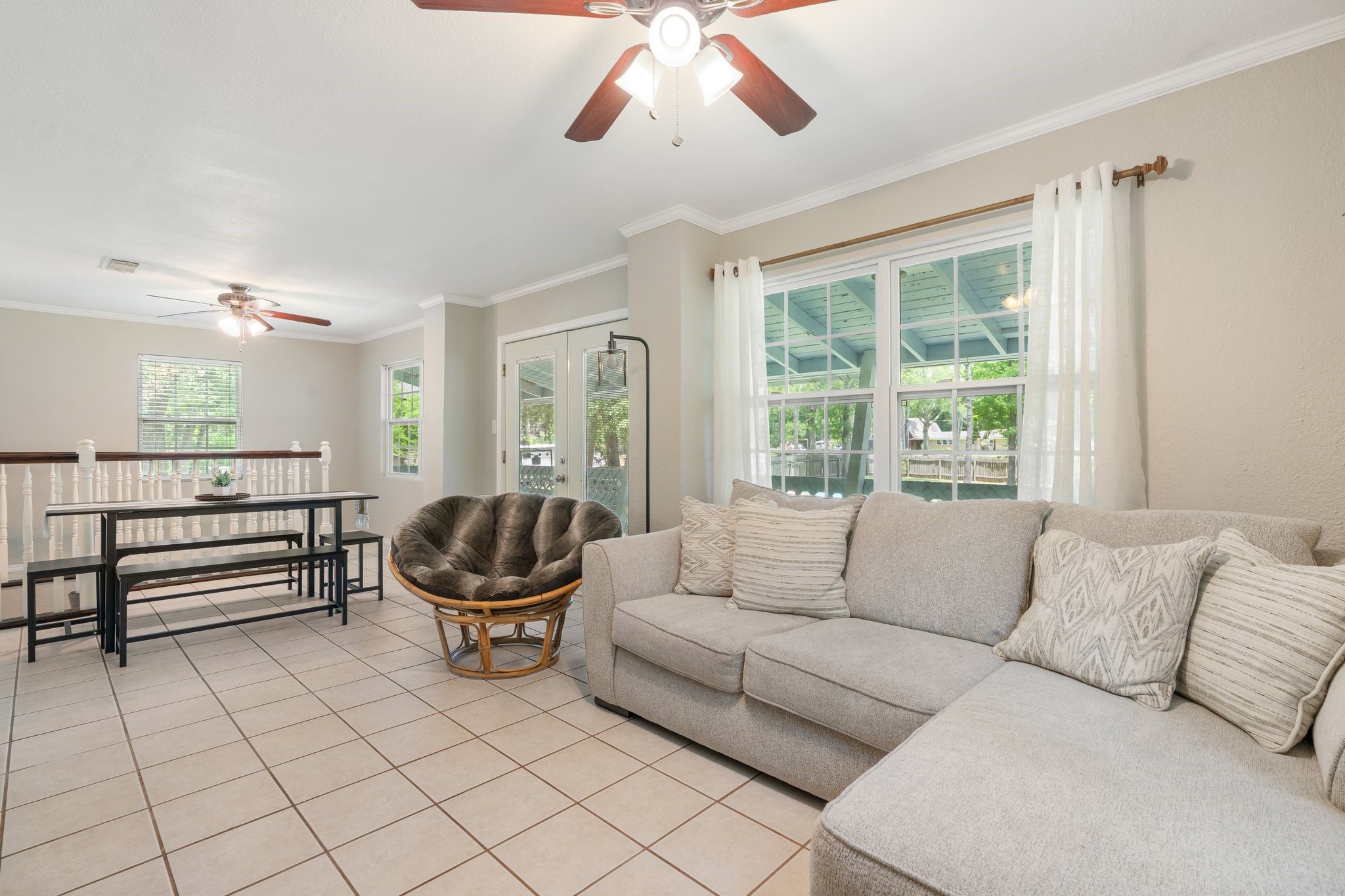 14758 Kirbee Drive Conroe, TX 77302 - Photo 24 of 35 This inviting second-floor living room offers a spacious, light-filled retreat perfect for relaxation and entertaining.