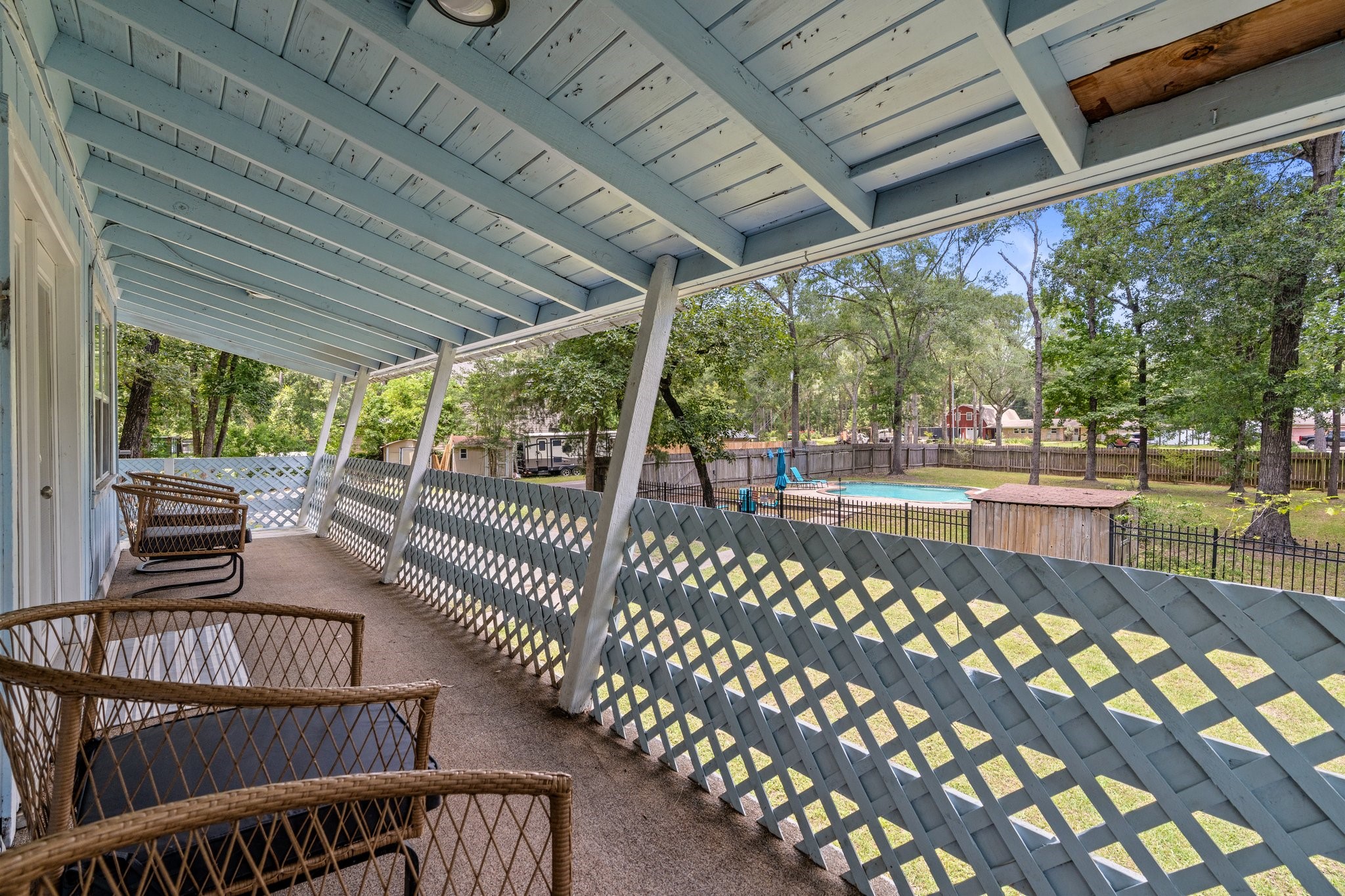 14758 Kirbee Drive Conroe, TX 77302 - Photo 32 of 35 Large covered patio upstairs and beautiful pool.