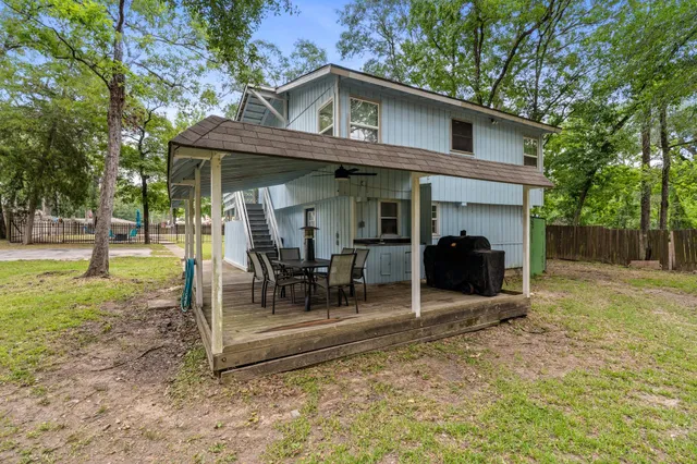a kitchen with stainless steel appliances granite countertop a sink stove refrigerator and cabinets