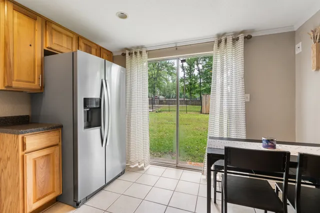 a bedroom with furniture and a flat screen tv