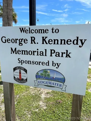 a view of swimming pool with a yard