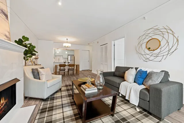 a living room with furniture a couch and a fireplace
