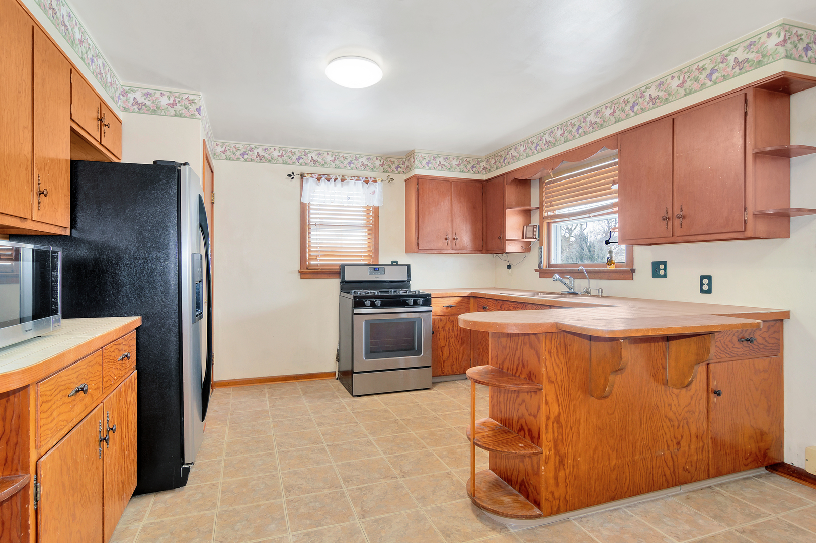 2288 North 3812th Road Serena, IL 60549 - Photo 5 of 13 a kitchen with stainless steel appliances granite countertop a refrigerator a stove a sink and a microwave