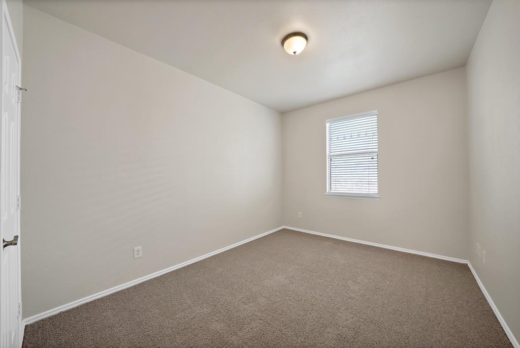 3813 Cane River Road Fort Worth, TX 76244 - Photo 16 of 28 an empty room with a window
