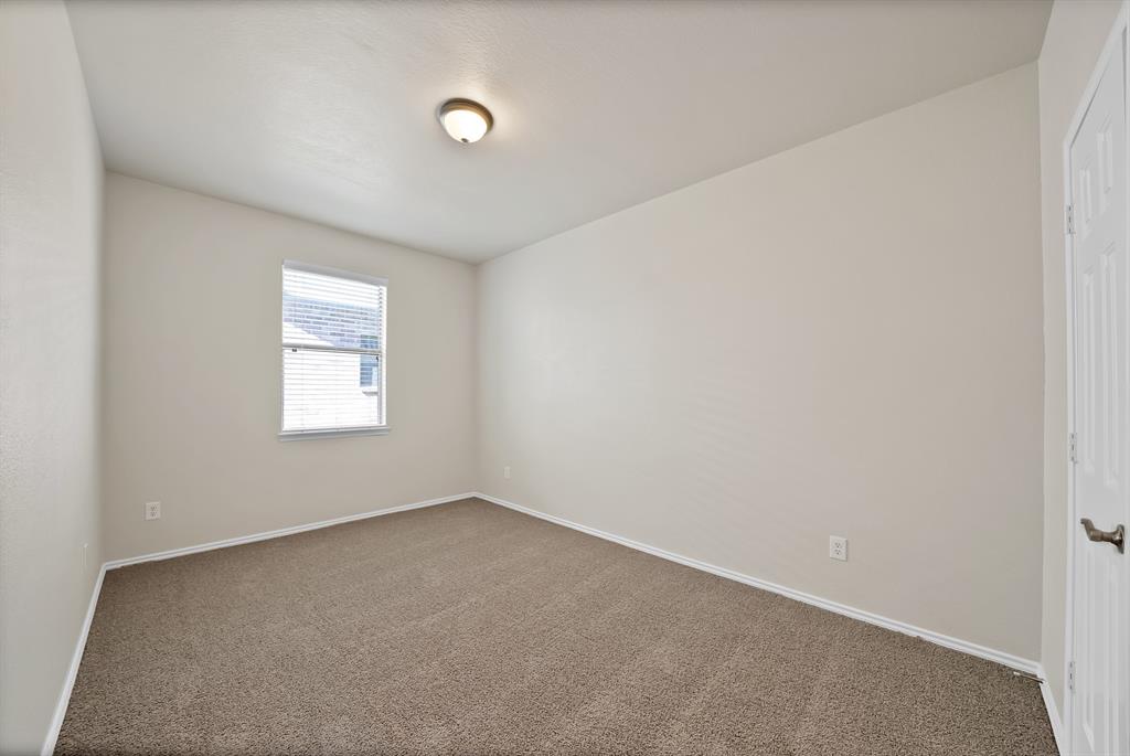 3813 Cane River Road Fort Worth, TX 76244 - Photo 18 of 28 an empty room with a window