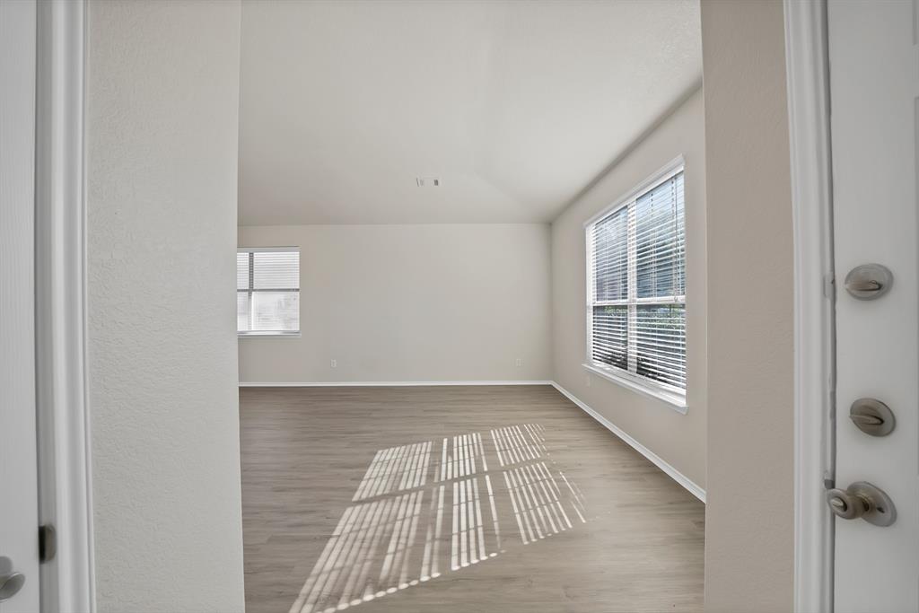 3813 Cane River Road Fort Worth, TX 76244 - Photo 4 of 28 an empty room with windows