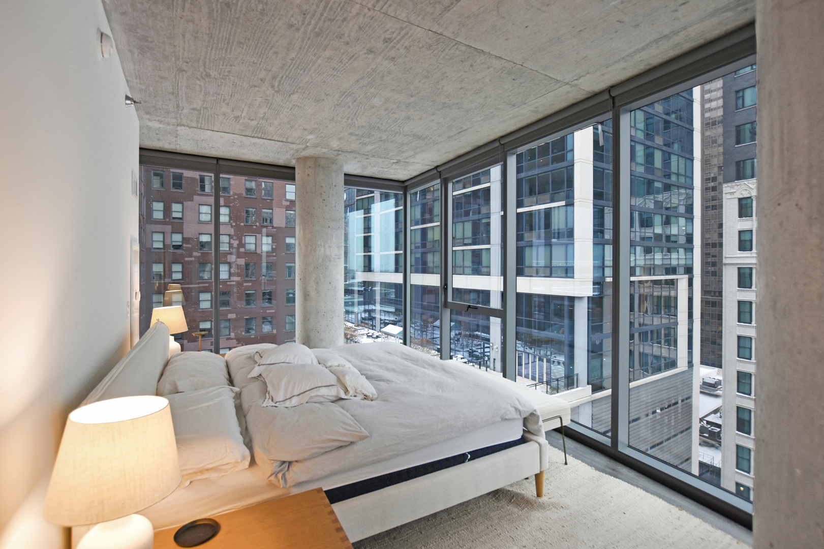 60 East Randolph Street, Unit 1303 Chicago, IL 60601 - Photo 12 of 38 a bedroom with furniture and large windows
