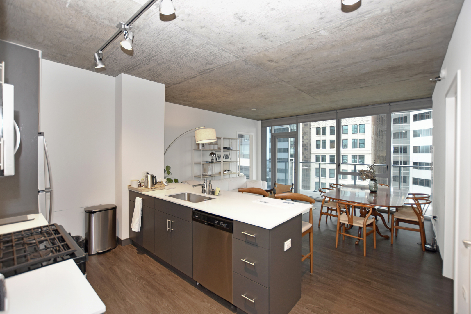 60 East Randolph Street, Unit 1303 Chicago, IL 60601 - Photo 4 of 38 a room with a table chairs and a dining table