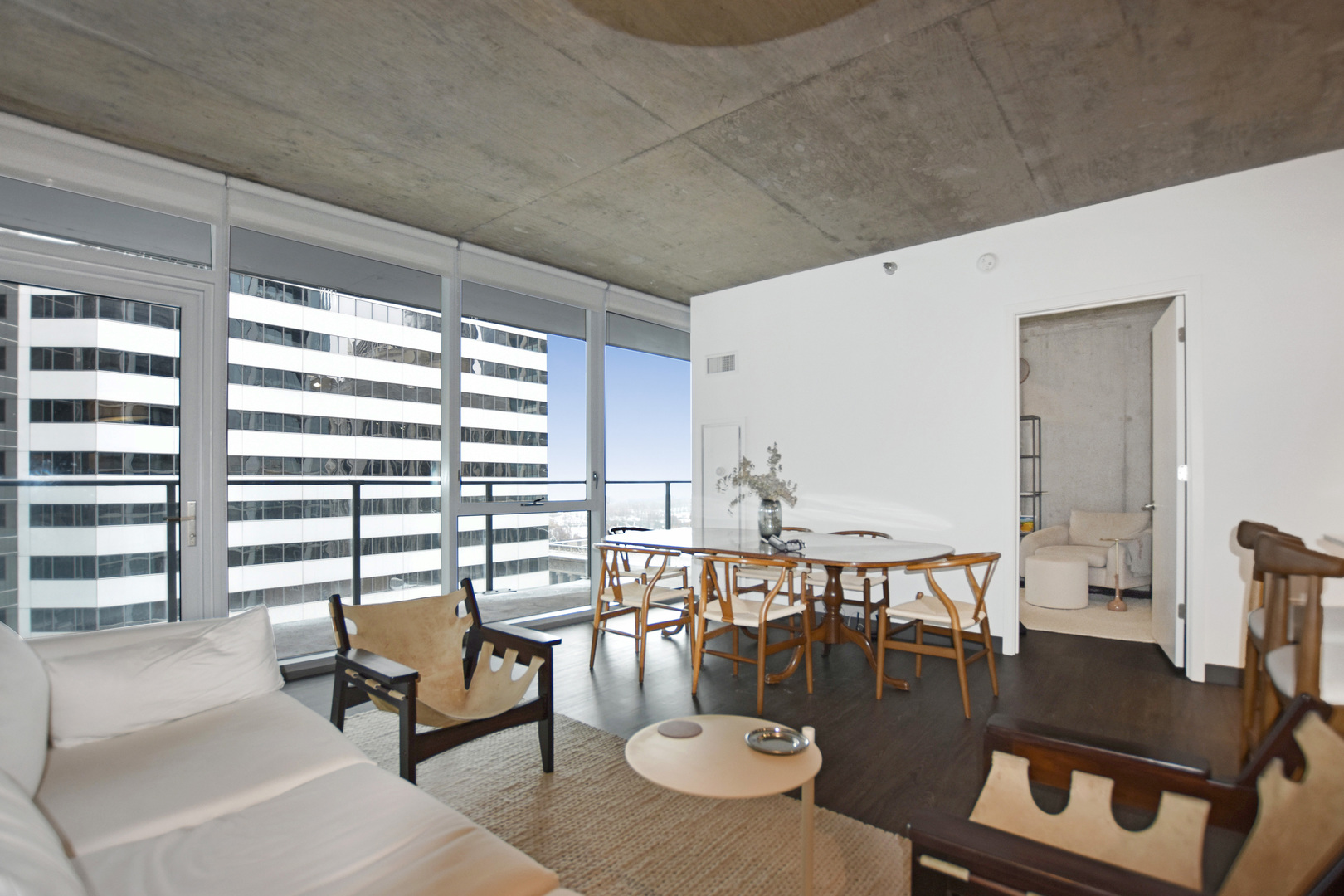 60 East Randolph Street, Unit 1303 Chicago, IL 60601 - Photo 6 of 38 a living room with furniture and a large window