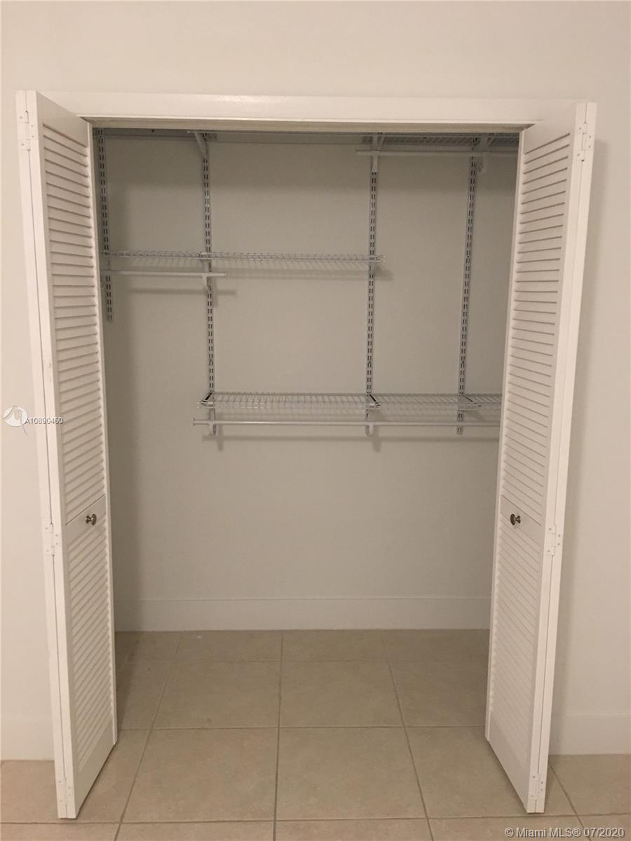 310 Southwest 34th Avenue, Unit 310 Miami, FL 33135 - Photo 13 of 18 a view of an empty walk in closet