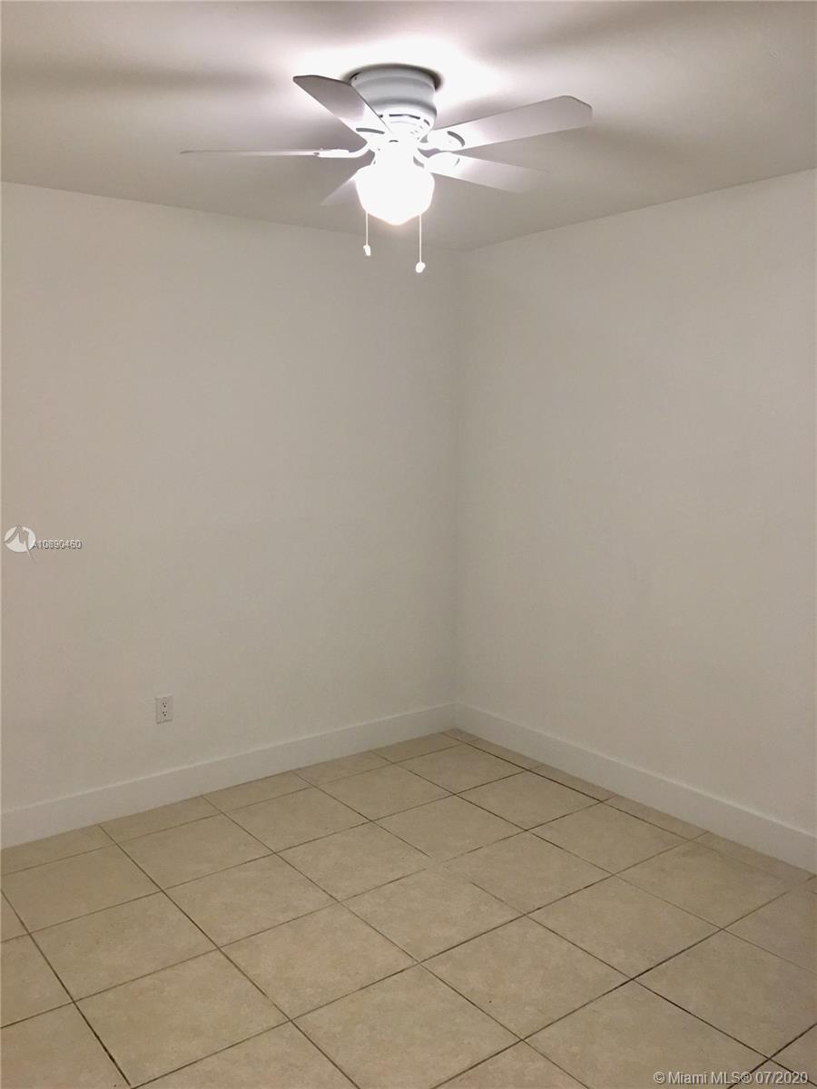 310 Southwest 34th Avenue, Unit 310 Miami, FL 33135 - Photo 16 of 18 a view of a chandelier fan in a room